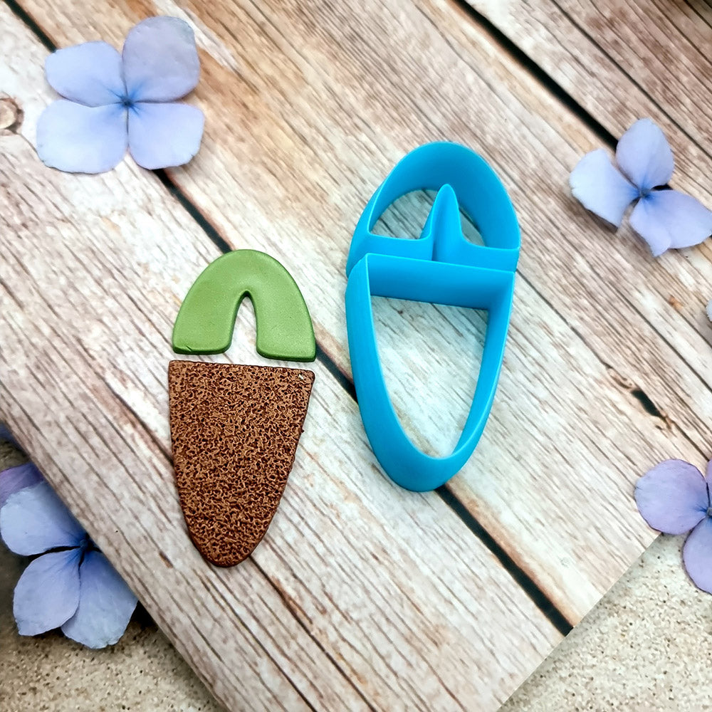 Blue PLA U-shape polymer clay cutters in three sizes cutting an arch band and tapered base, with finished plaid and floral clay pieces by SweetyBijou