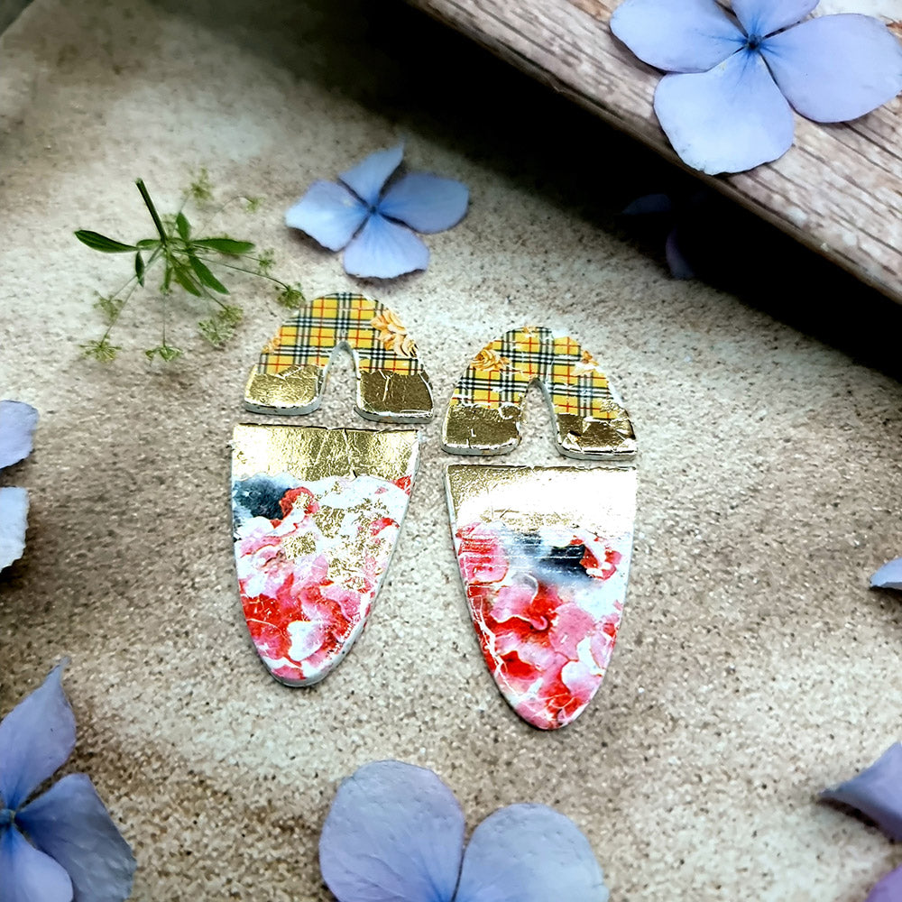 Blue PLA U-shape polymer clay cutters in three sizes cutting an arch band and tapered base, with finished plaid and floral clay pieces by SweetyBijou