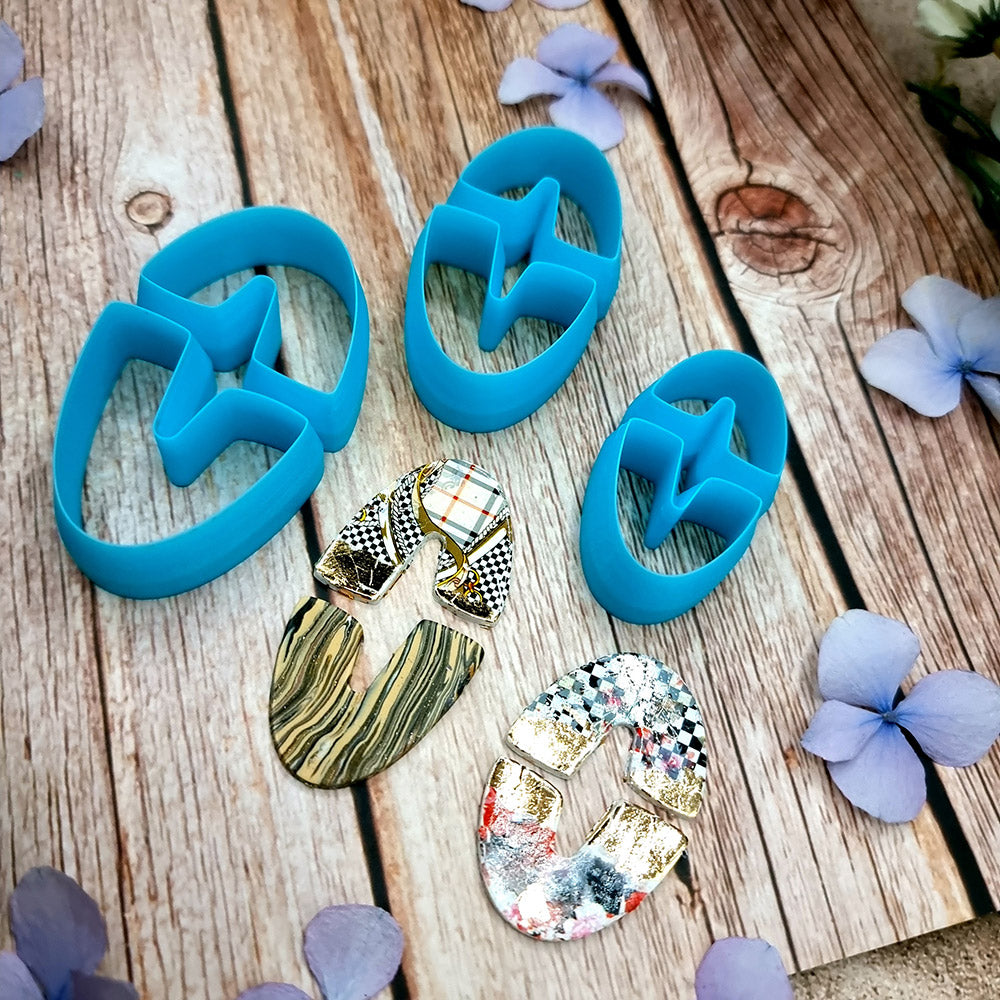 Blue PLA oval U-shape polymer clay cutters in three sizes with finished checkerboard, marbled and glitter clay earring pieces by SweetyBijou