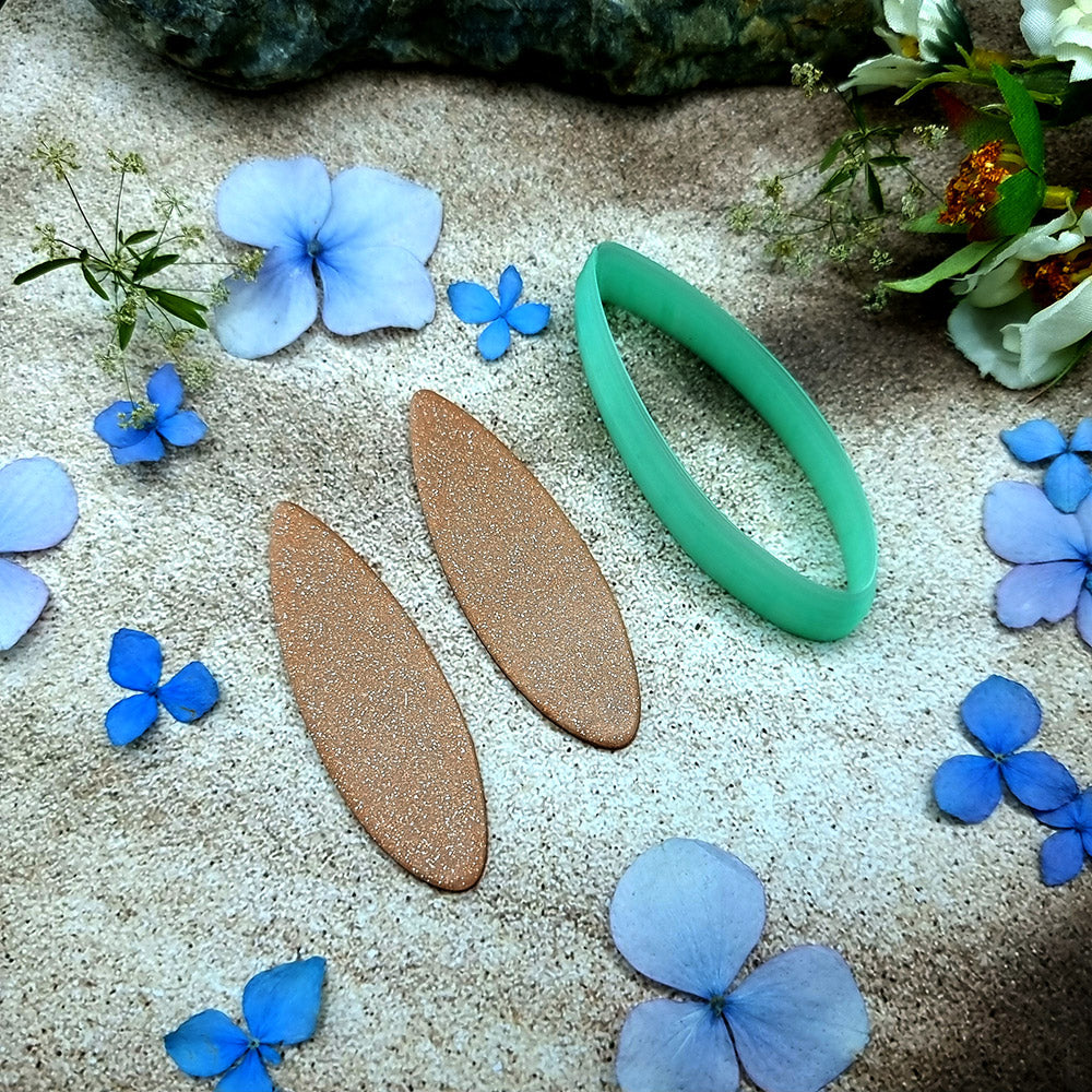 Green PLA almond drop polymer clay cutter with softly pointed ends and terracotta clay almond earring pieces by SweetyBijou