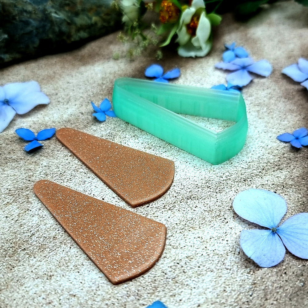 Green PLA slanted wedge polymer clay cutter with a broad angled base and terracotta clay wedge earring pieces by SweetyBijou