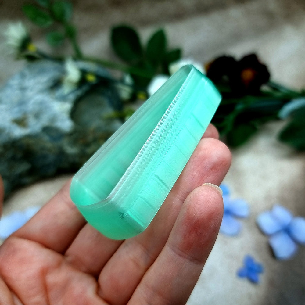 Green PLA long teardrop polymer clay cutter with a pointed top and rounded base, with terracotta clay teardrop earring pieces by SweetyBijou
