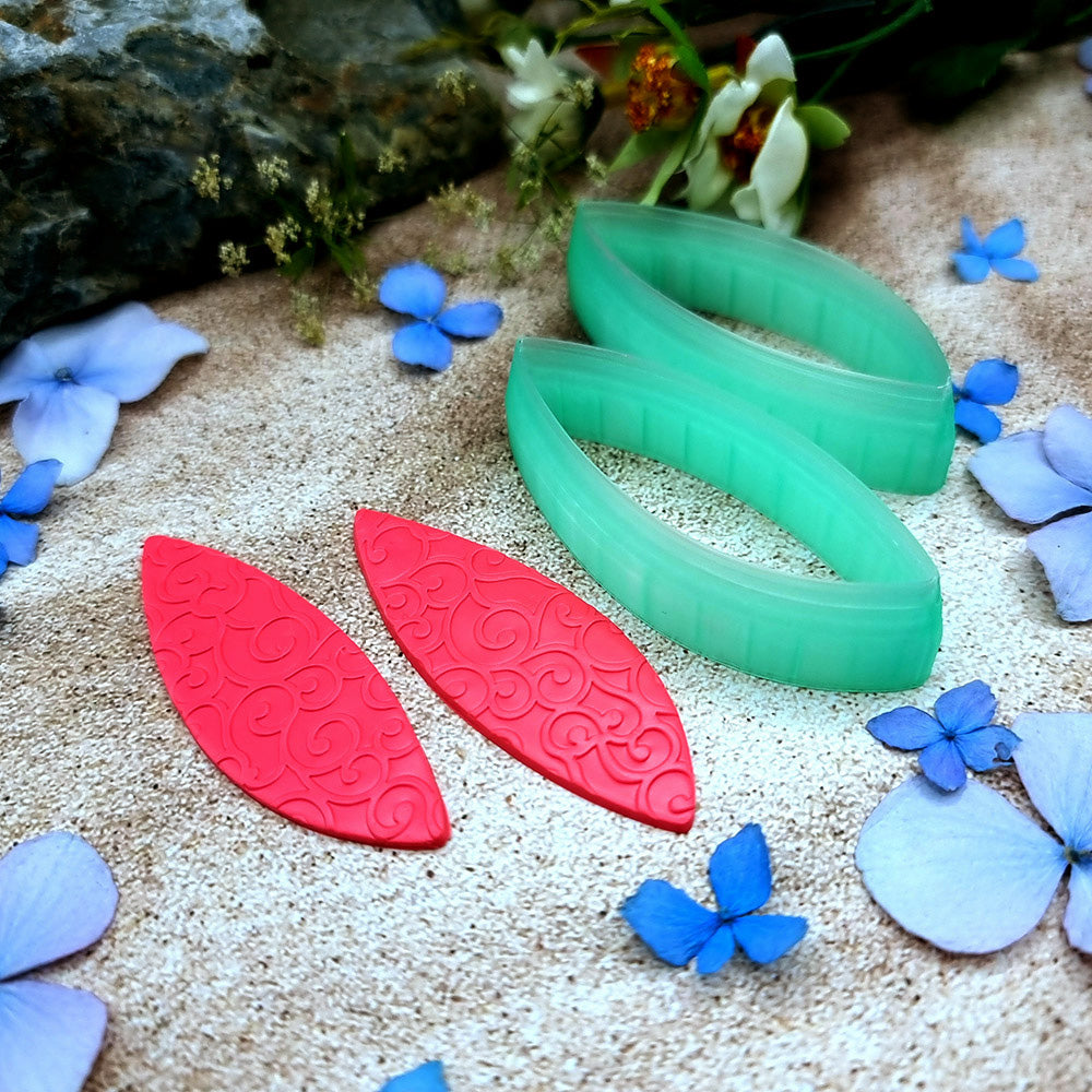 Pair of mirrored green PLA curved leaf polymer clay cutters, a left and a right cutter, for long statement earrings by SweetyBijou