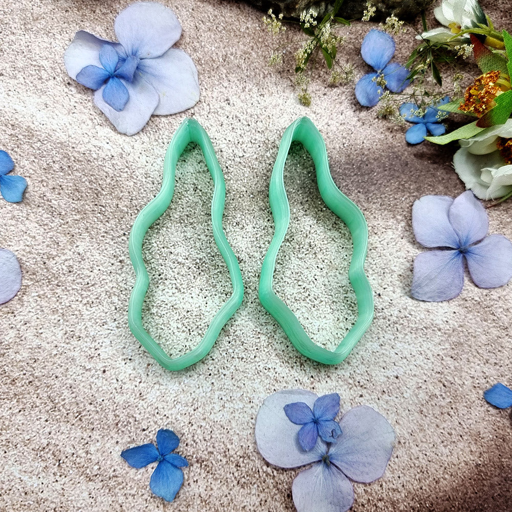 Pair of mirrored green PLA wavy feather polymer clay cutters, a left and a right cutter, for long statement earrings by SweetyBijou