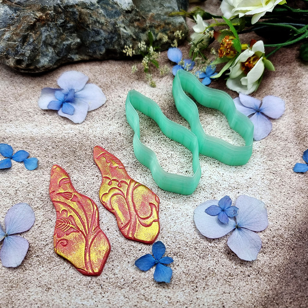 Pair of mirrored green PLA wavy feather polymer clay cutters, a left and a right cutter, for long statement earrings by SweetyBijou