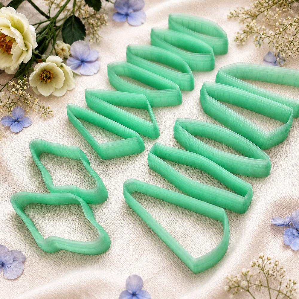 Bundle of green PLA long polymer clay cutters in slim marquise, oval and wedge shapes, all 6 cm long, for statement earrings by SweetyBijou