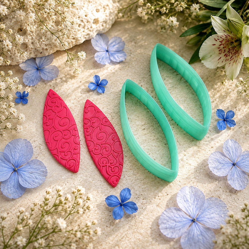 Pair of mirrored green PLA curved leaf polymer clay cutters, a left and a right cutter, for long statement earrings by SweetyBijou