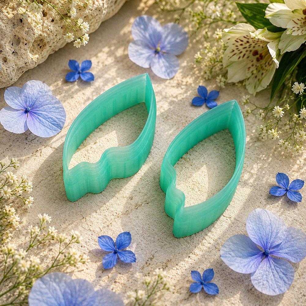 Pair of mirrored green PLA flame petal polymer clay cutters, a left and a right cutter, for long statement earrings by SweetyBijou