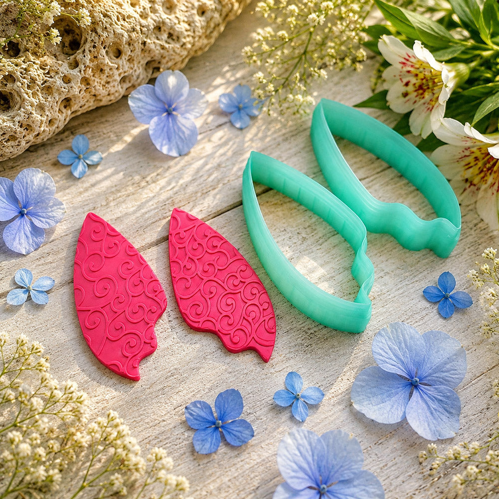Pair of mirrored green PLA flame petal polymer clay cutters, a left and a right cutter, for long statement earrings by SweetyBijou