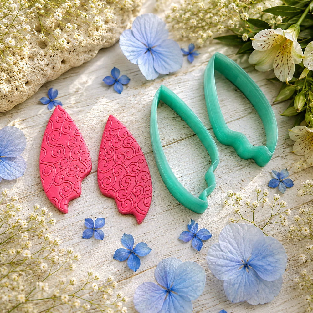 Pair of mirrored green PLA flame petal polymer clay cutters, a left and a right cutter, for long statement earrings by SweetyBijou