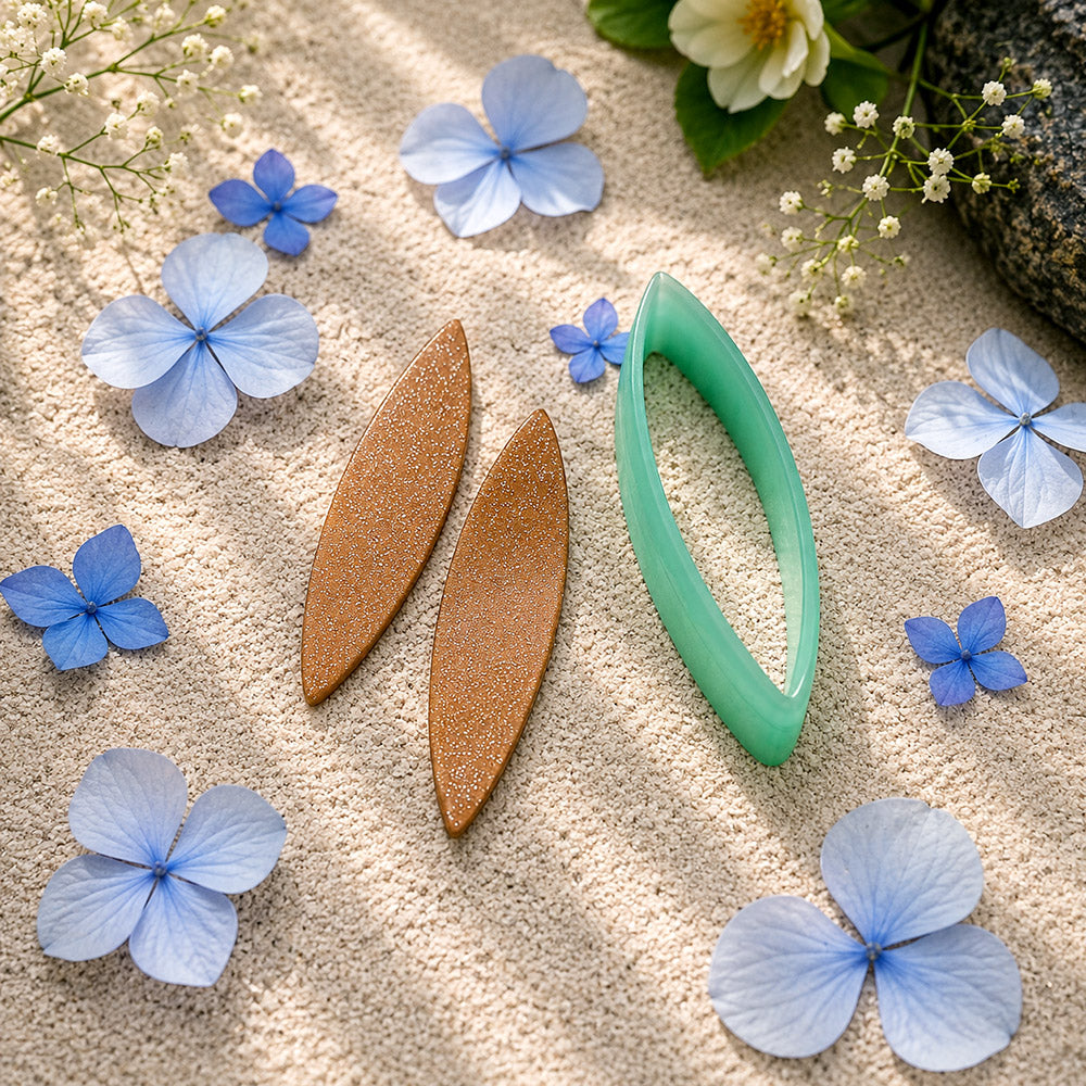 Green PLA broad leaf polymer clay cutter with a pointed marquise outline and terracotta clay leaf earring pieces by SweetyBijou
