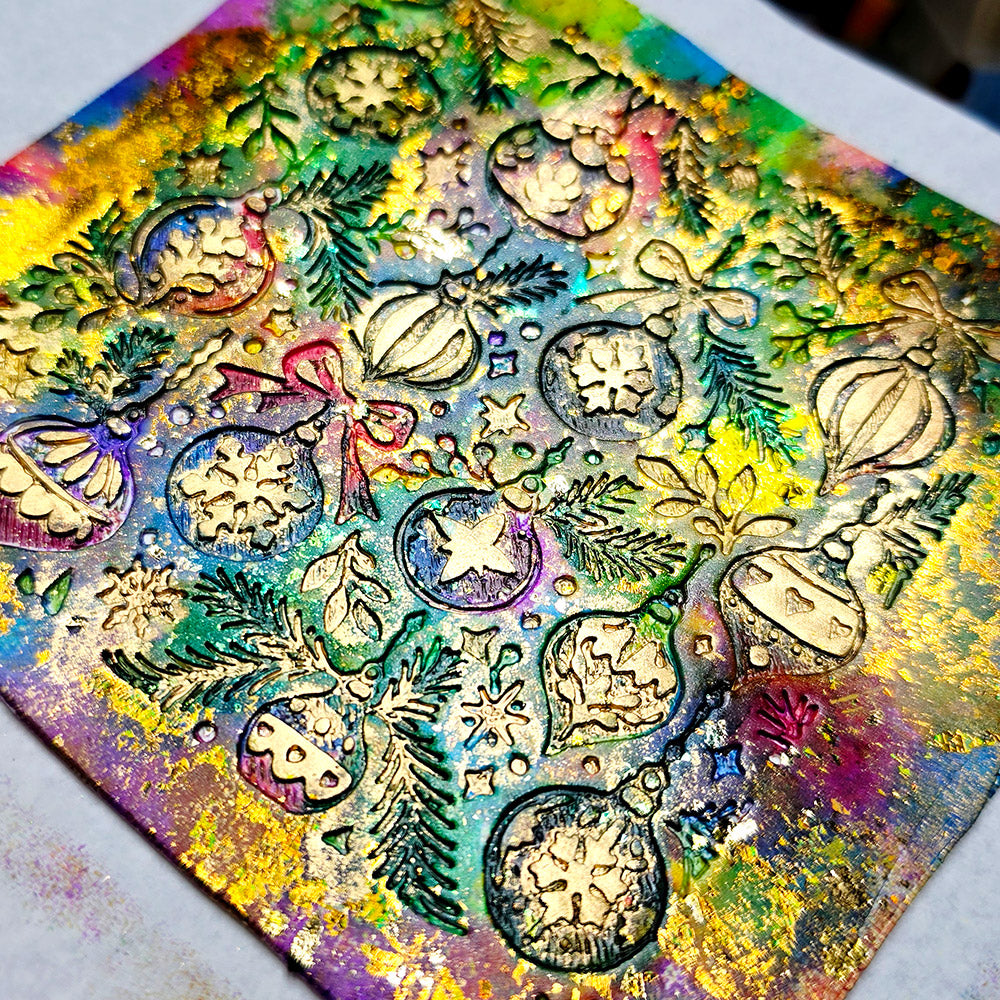 Polymer clay sheet textured with the Christmas Ornaments Christmas texture plate