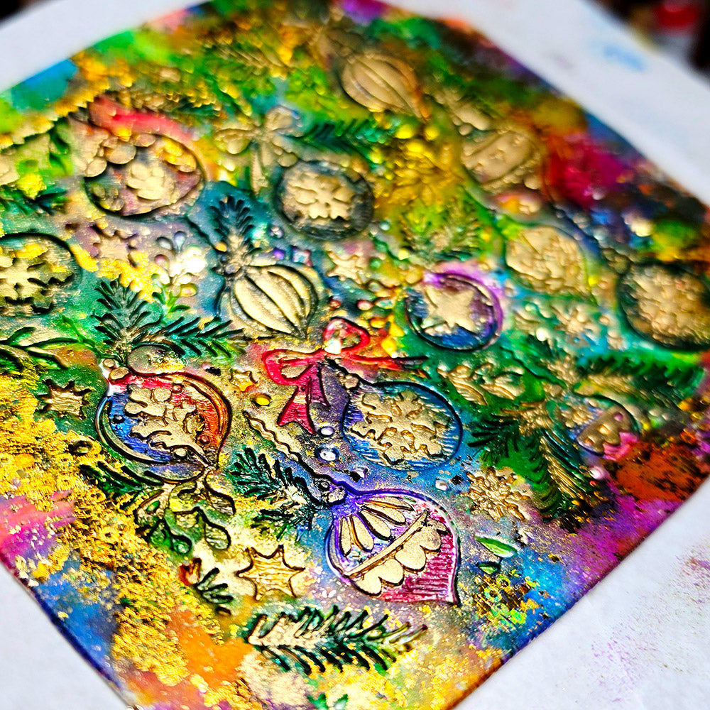 Polymer clay sheet textured with the Christmas Ornaments Christmas texture plate