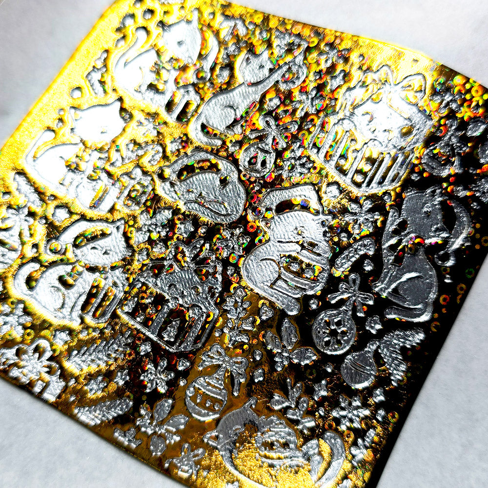 Polymer clay sheet textured with the Christmas Cats Christmas texture plate