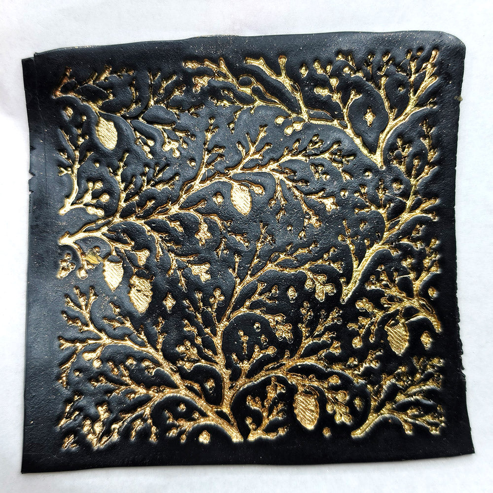Polymer clay sheet textured with the Bare Winter Branches Christmas texture plate