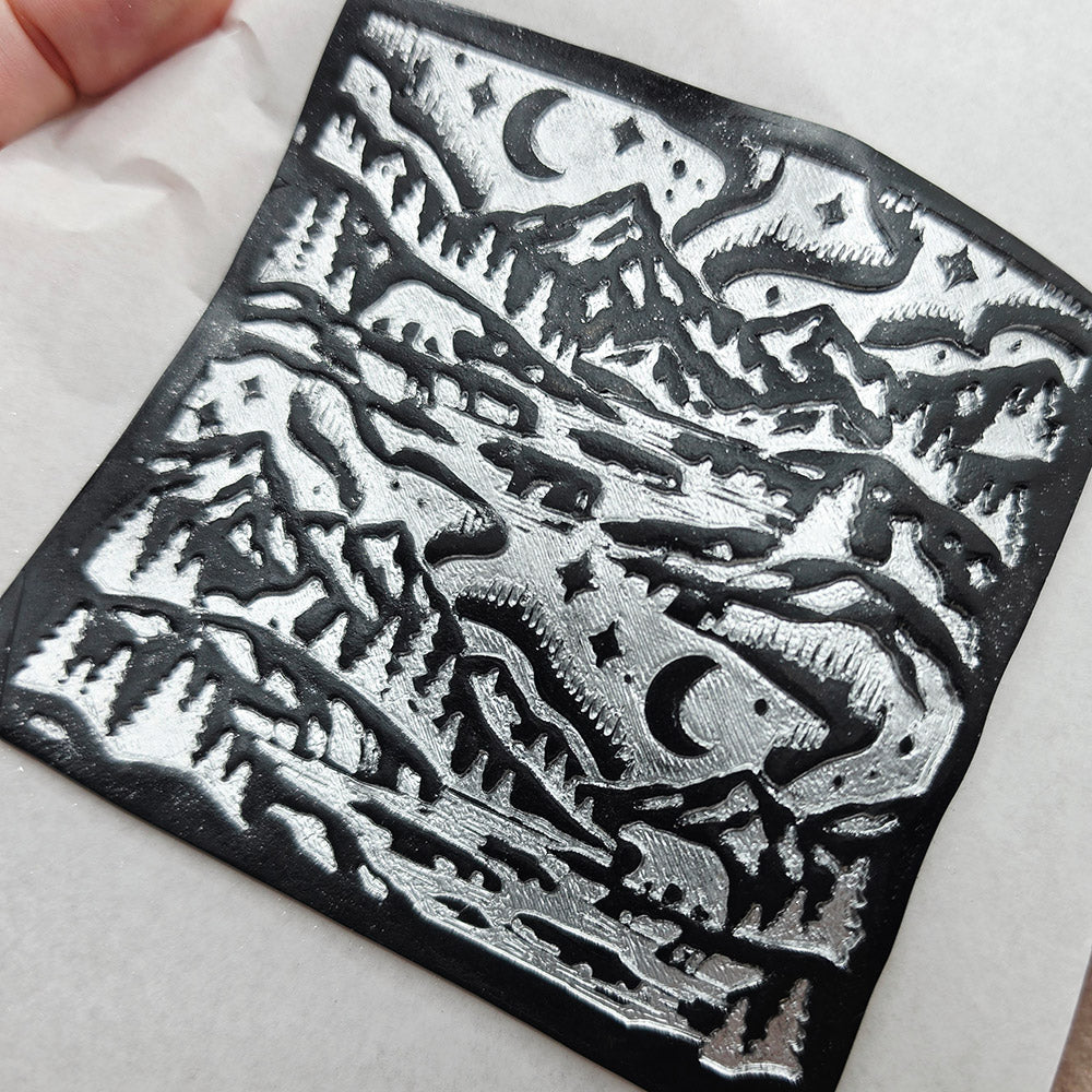Polymer clay sheet textured with the Arctic Night Christmas texture plate