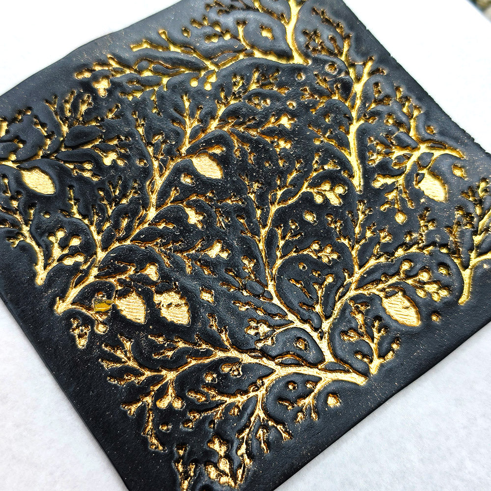 Polymer clay sheet textured with the Bare Winter Branches Christmas texture plate