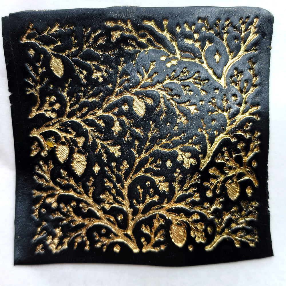 Polymer clay sheet textured with the Bare Winter Branches Christmas texture plate