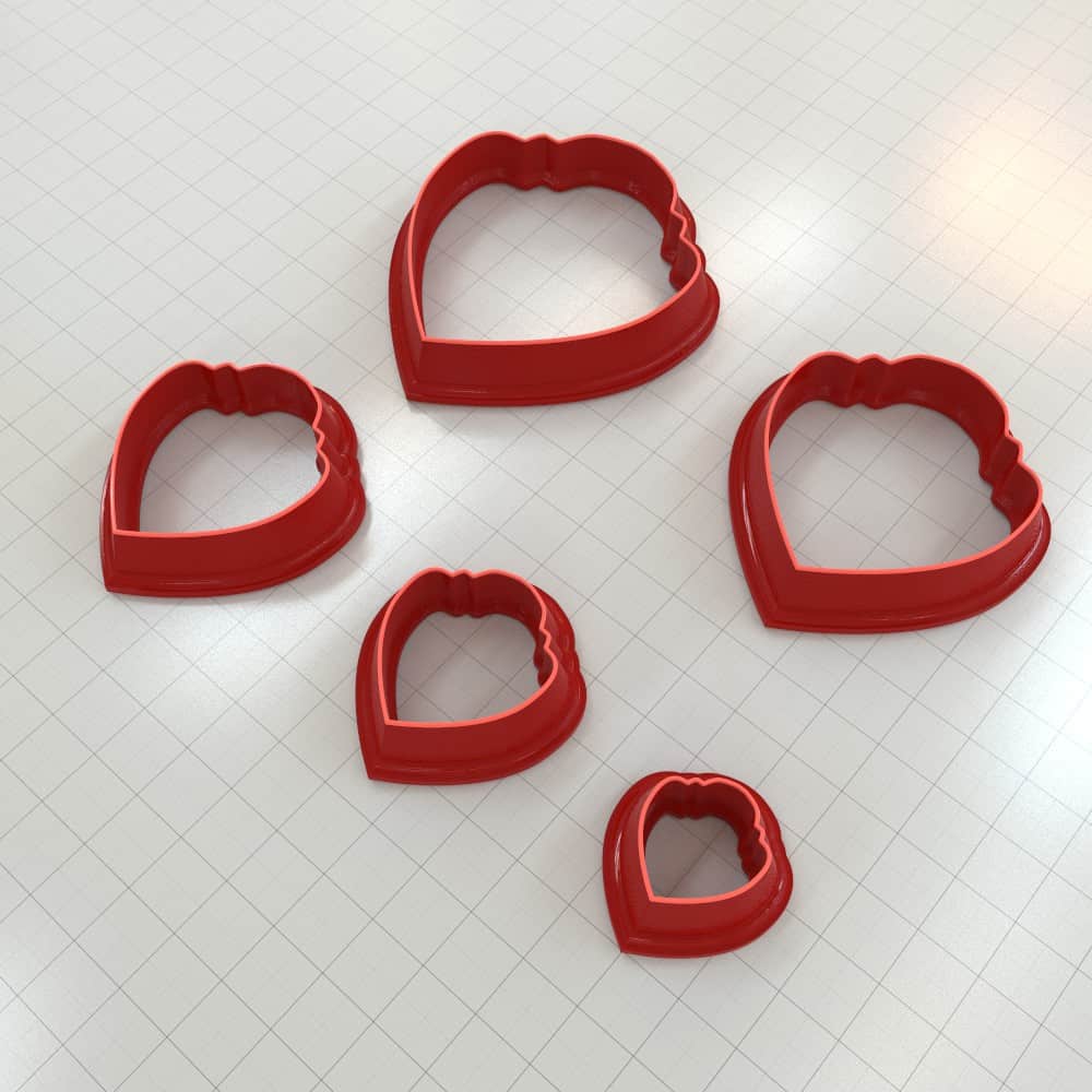 Scalloped teardrop polymer clay cutter with lobed top and wavy scalloped edges