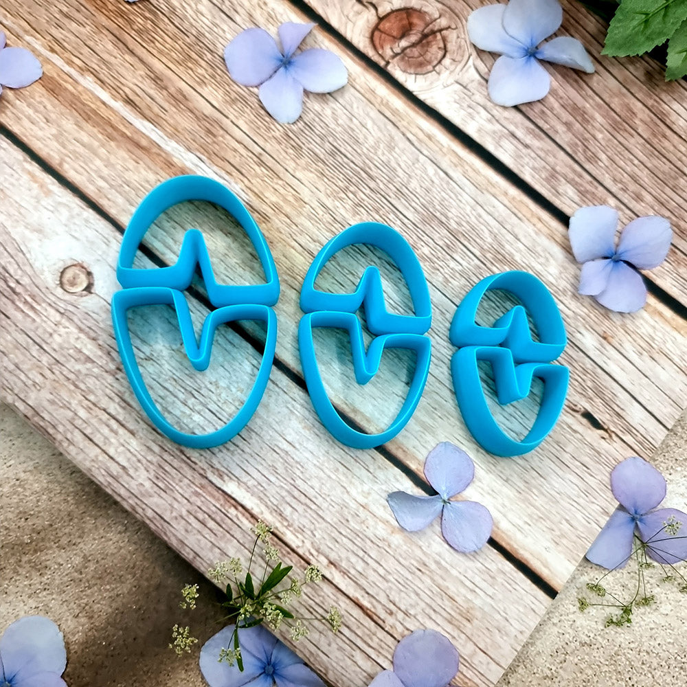 Blue PLA oval U-shape polymer clay cutters in three sizes with finished checkerboard, marbled and glitter clay earring pieces by SweetyBijou