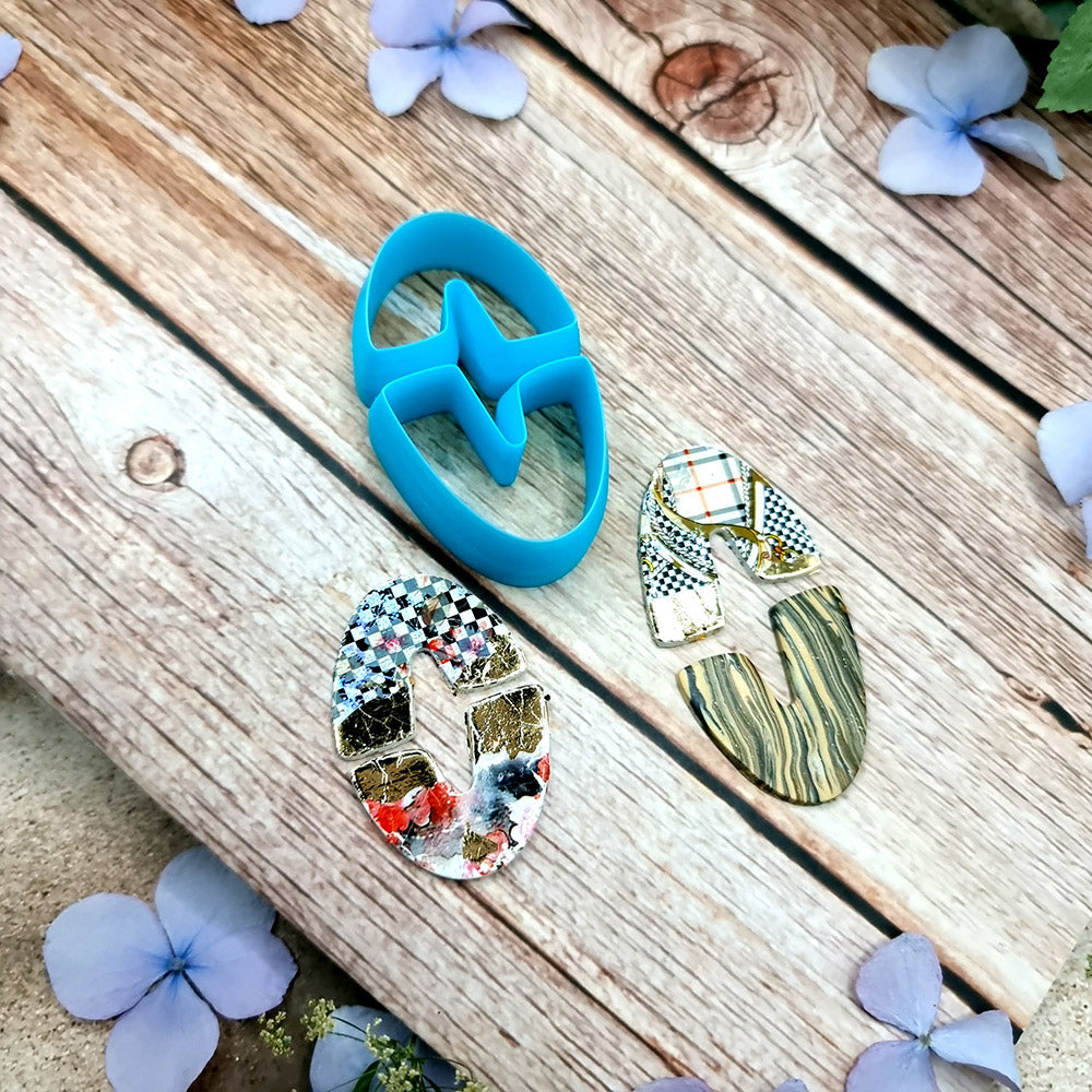 Blue PLA oval U-shape polymer clay cutters in three sizes with finished checkerboard, marbled and glitter clay earring pieces by SweetyBijou