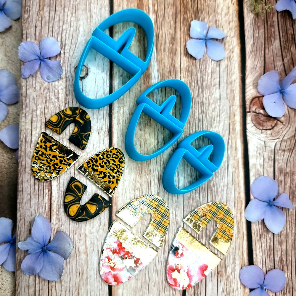 Blue PLA oval polymer clay cutters in three sizes with internal U divider and finished leopard, checkerboard and floral clay pieces by SweetyBijou