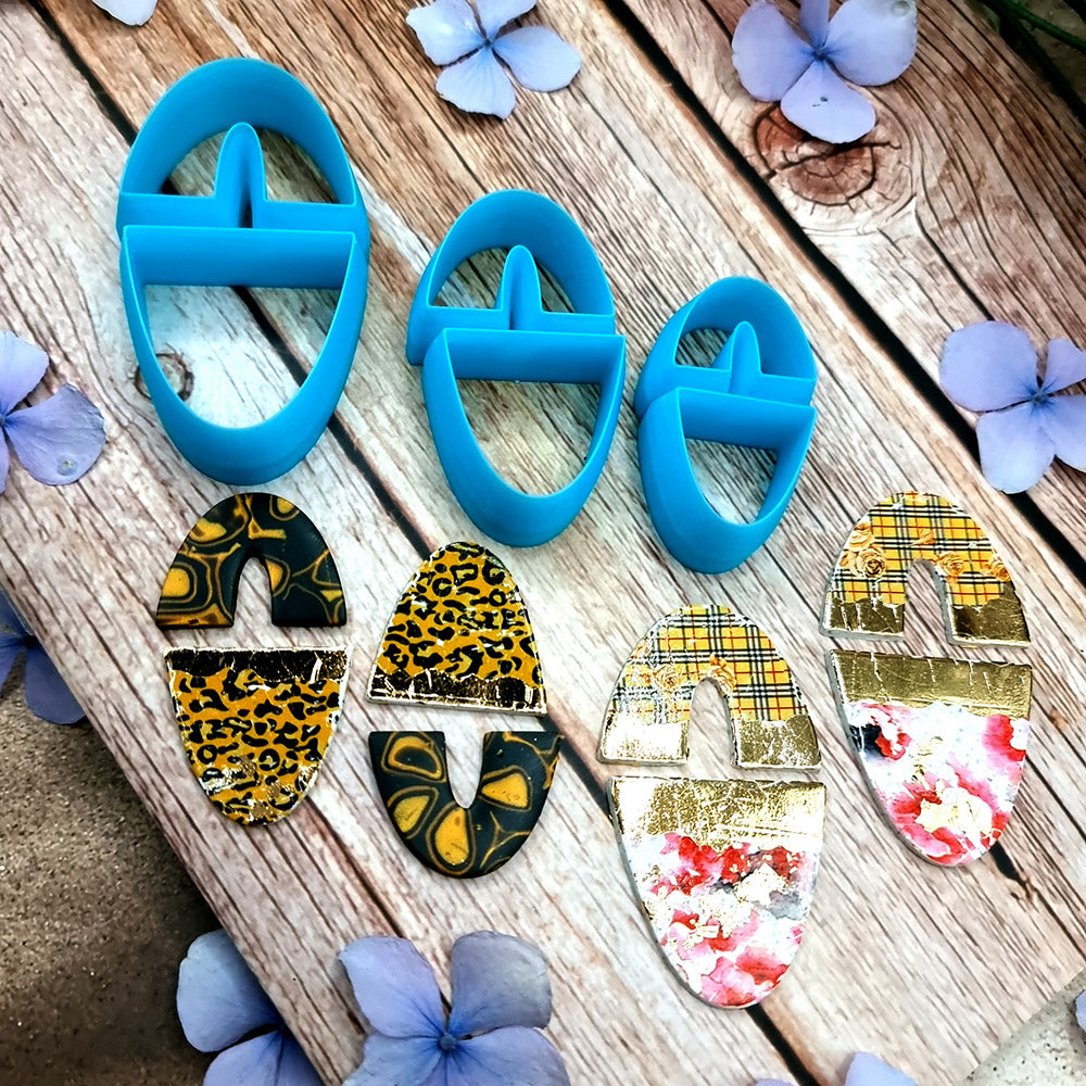 Blue PLA oval polymer clay cutters in three sizes with internal U divider and finished leopard, checkerboard and floral clay pieces by SweetyBijou