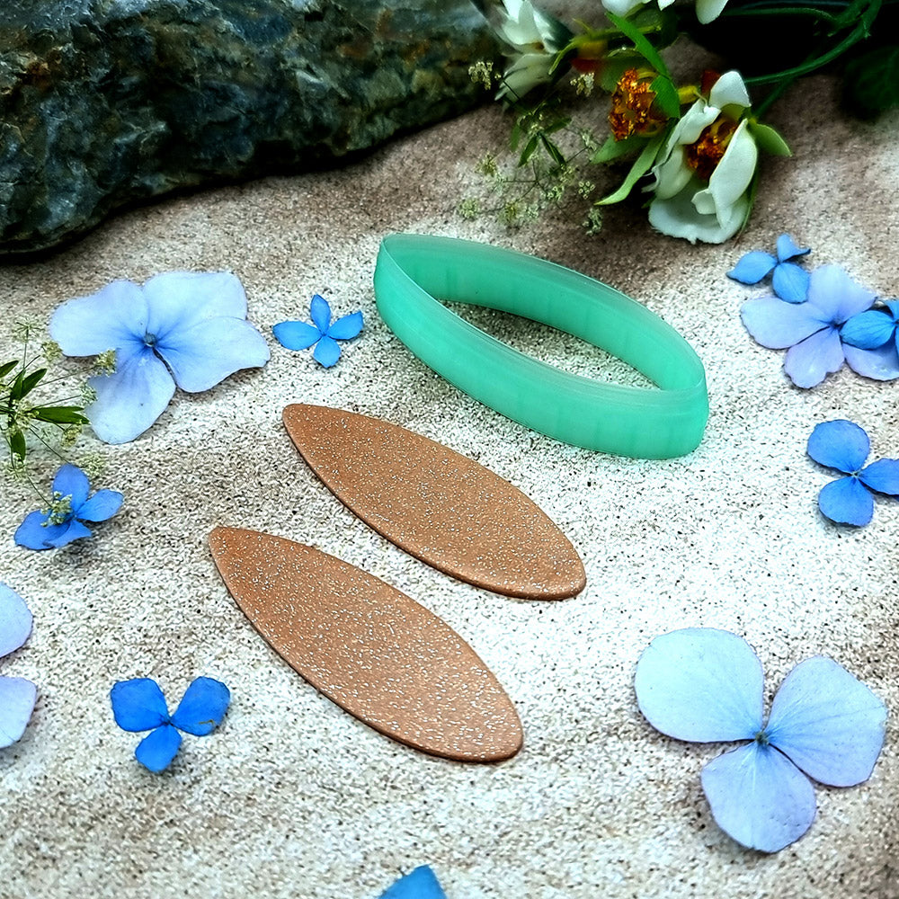Green PLA almond drop polymer clay cutter with softly pointed ends and terracotta clay almond earring pieces by SweetyBijou