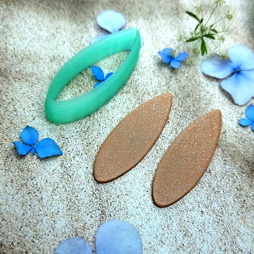 Green PLA almond drop polymer clay cutter with softly pointed ends and terracotta clay almond earring pieces by SweetyBijou
