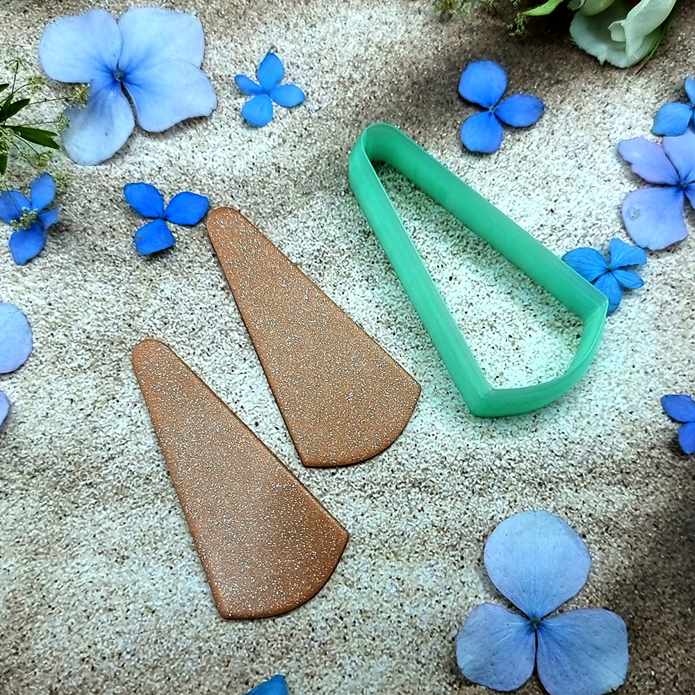 Green PLA slanted wedge polymer clay cutter with a broad angled base and terracotta clay wedge earring pieces by SweetyBijou