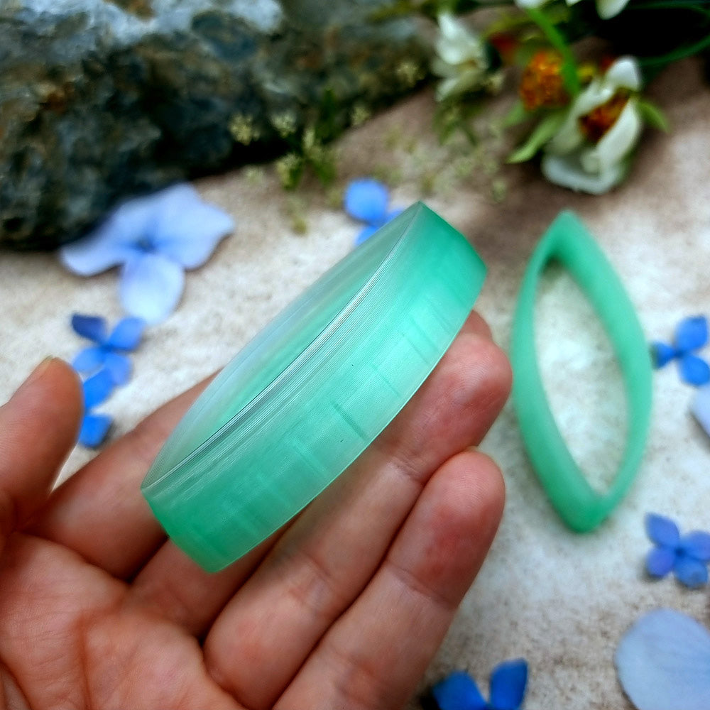 Pair of mirrored green PLA curved leaf polymer clay cutters, a left and a right cutter, for long statement earrings by SweetyBijou