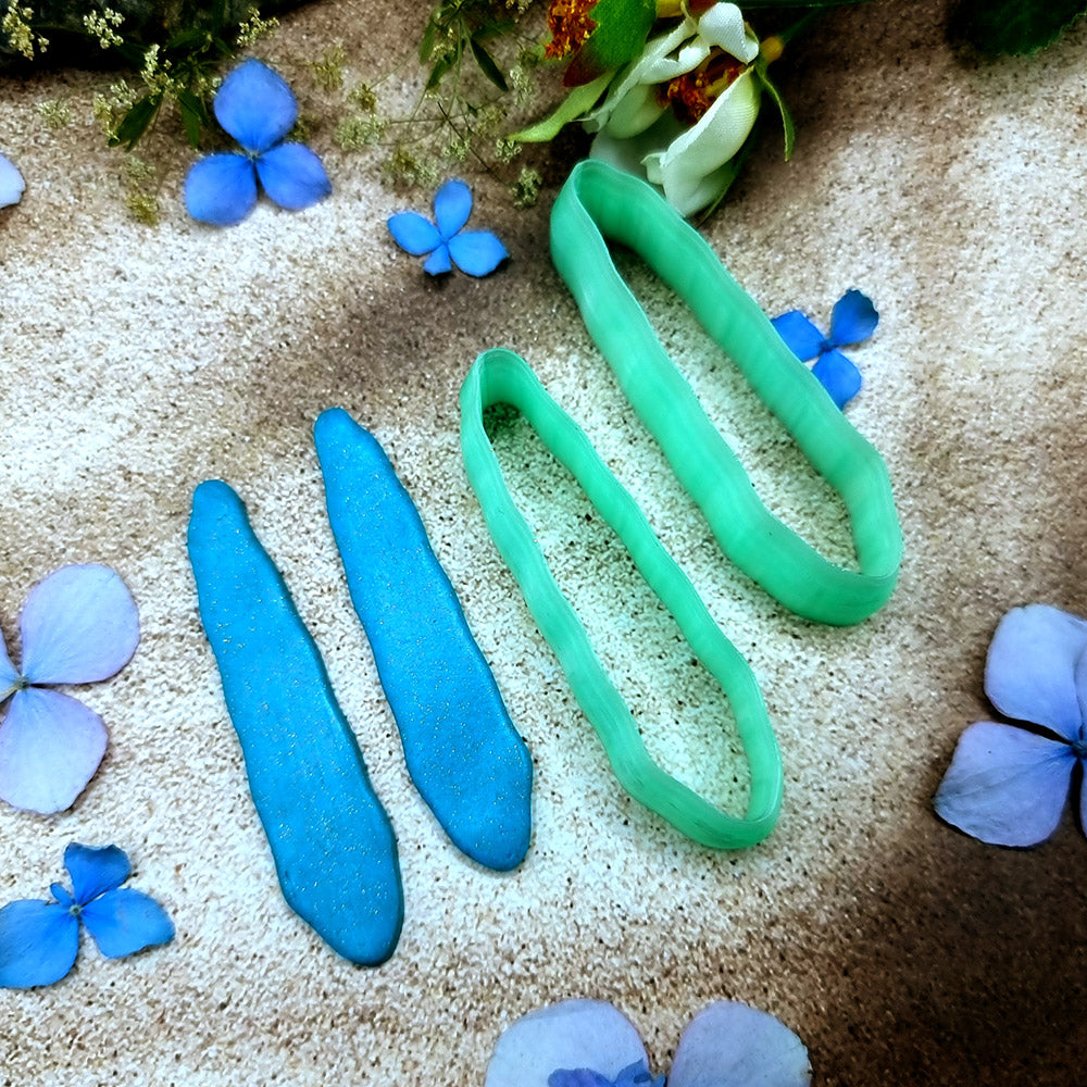 Pair of mirrored green PLA slim petal polymer clay cutters, a left and a right cutter, for long statement earrings by SweetyBijou