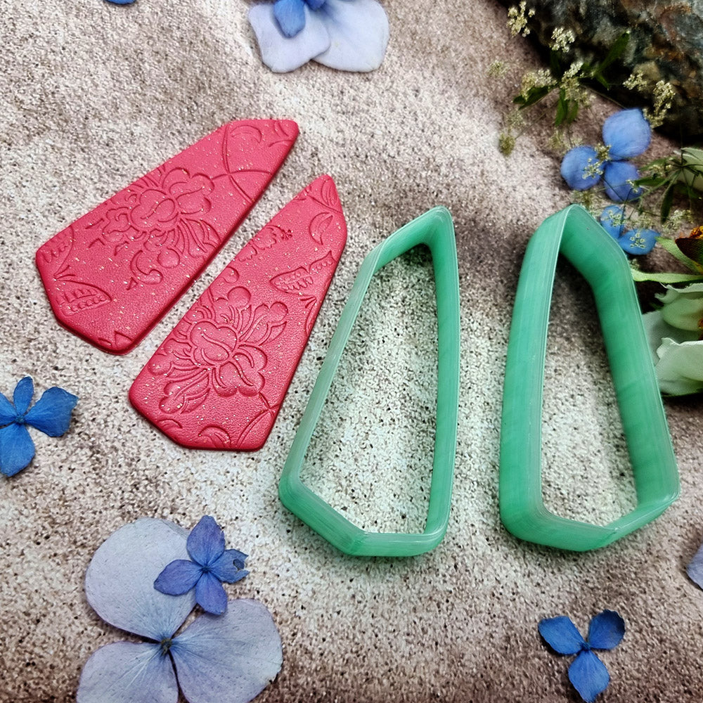 Pair of mirrored green PLA broad wedge polymer clay cutters, a left and a right cutter, for long statement earrings by SweetyBijou
