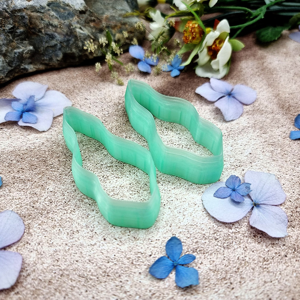 Pair of mirrored green PLA wavy feather polymer clay cutters, a left and a right cutter, for long statement earrings by SweetyBijou