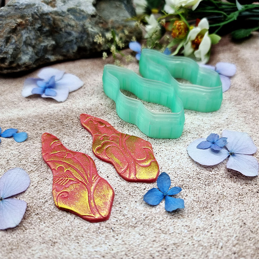 Pair of mirrored green PLA wavy feather polymer clay cutters, a left and a right cutter, for long statement earrings by SweetyBijou