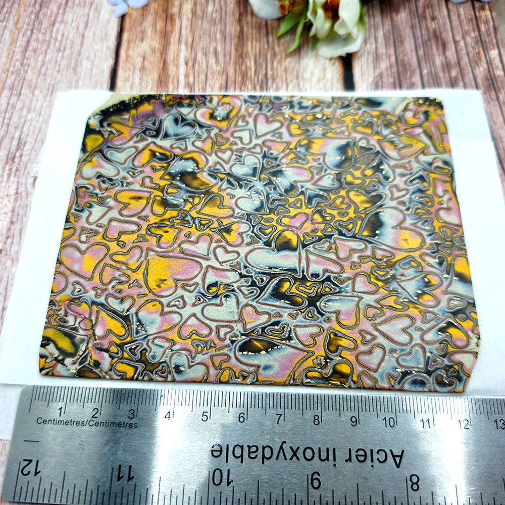 Raw polymer clay veneer sheet, Golden Hearts Mokume Gane