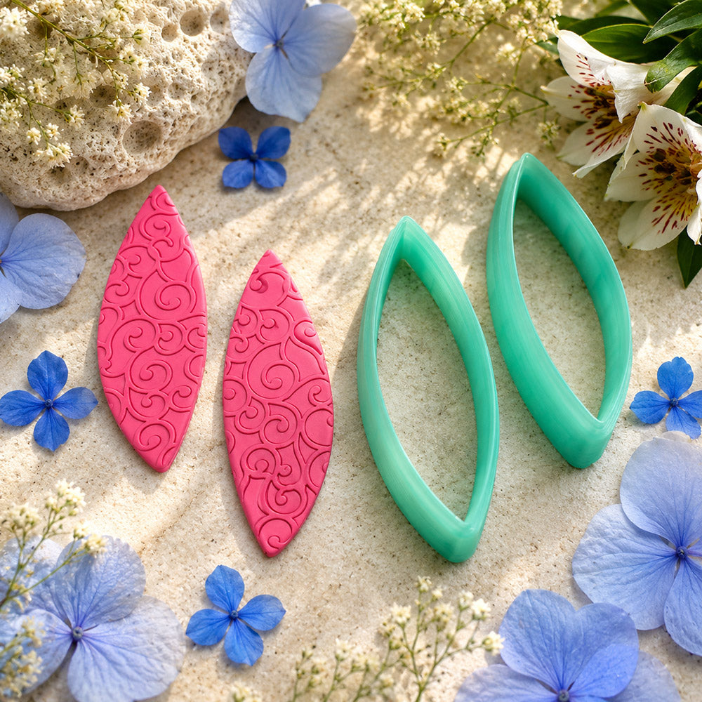 Pair of mirrored green PLA curved leaf polymer clay cutters, a left and a right cutter, for long statement earrings by SweetyBijou