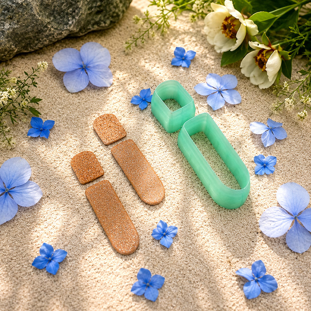Green PLA stacked bar polymer clay cutter that cuts a small stud and a long rounded bar, with terracotta clay earring pieces by SweetyBijou