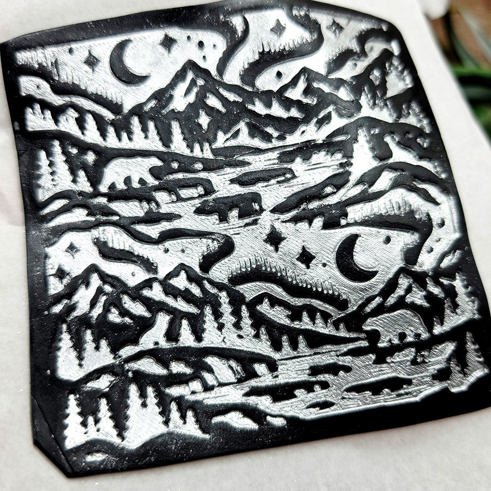 Polymer clay sheet textured with the Arctic Night Christmas texture plate