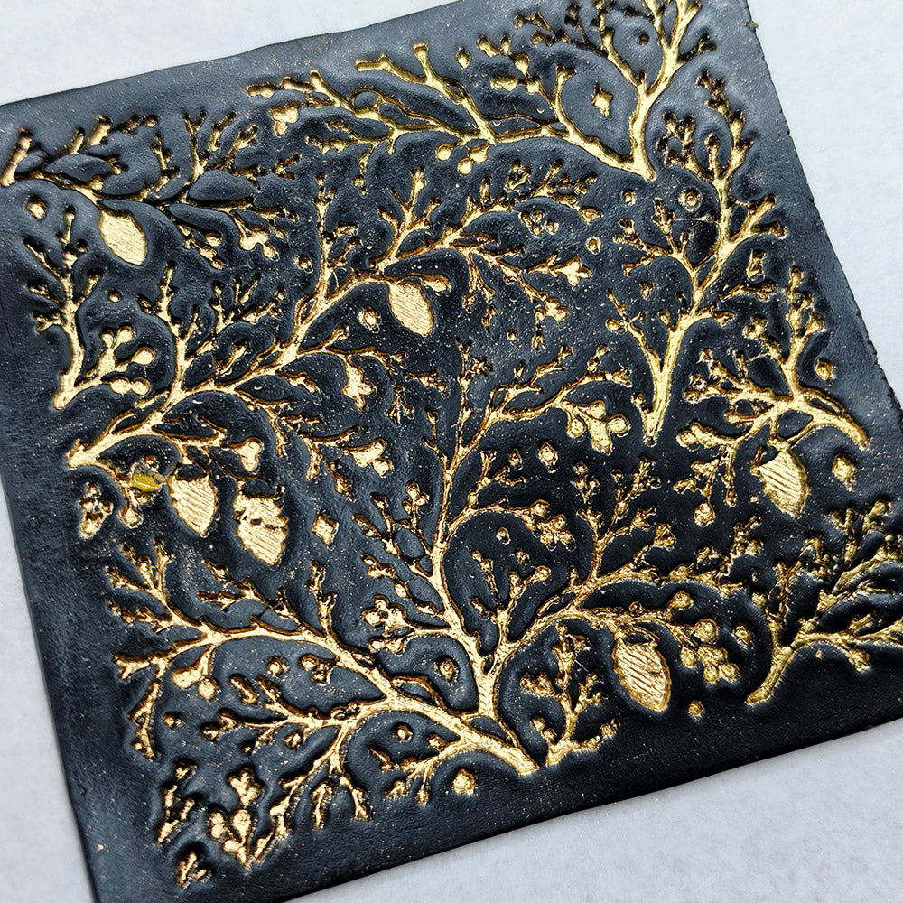 Polymer clay sheet textured with the Bare Winter Branches Christmas texture plate