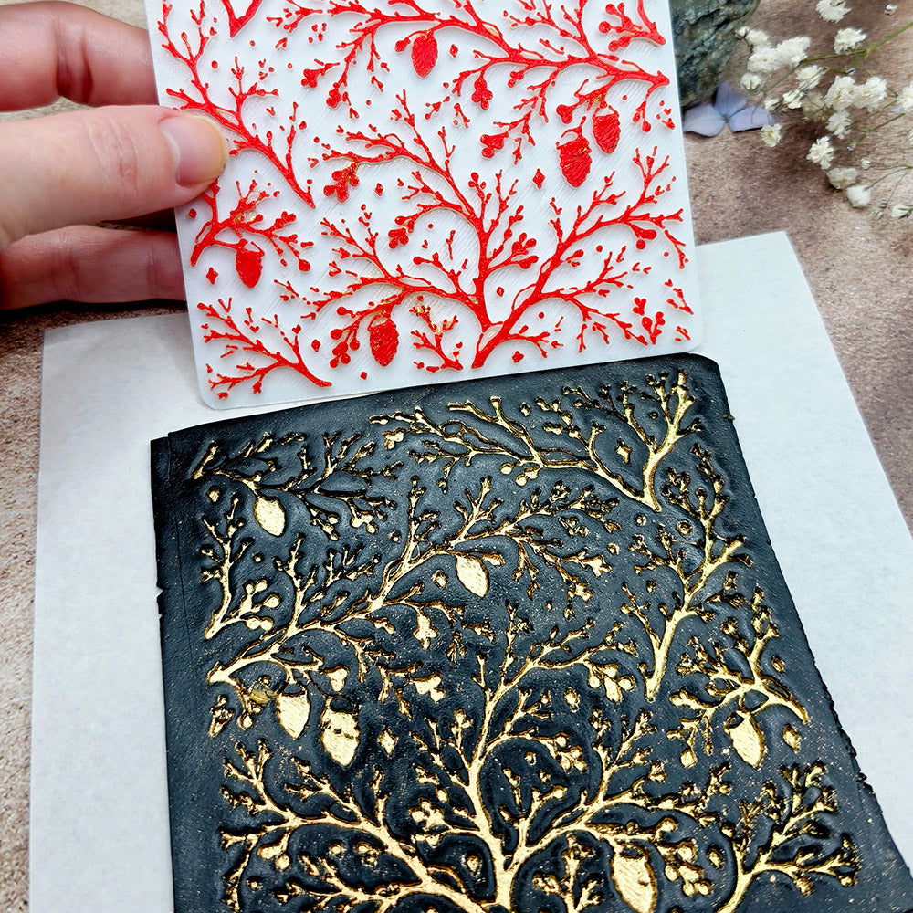 Polymer clay sheet textured with the Bare Winter Branches Christmas texture plate