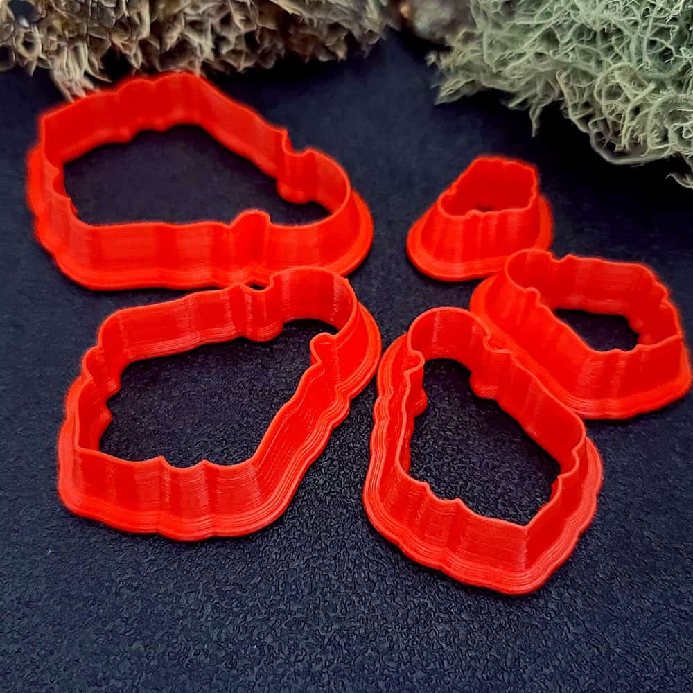 Vintage bell shape polymer clay cutter with curved body and wavy scalloped hem