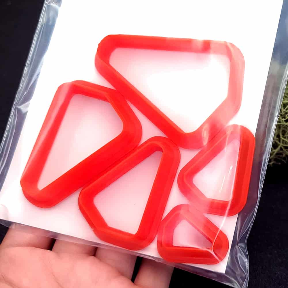 Rounded triangle polymer clay cutter with soft corners and apex at top