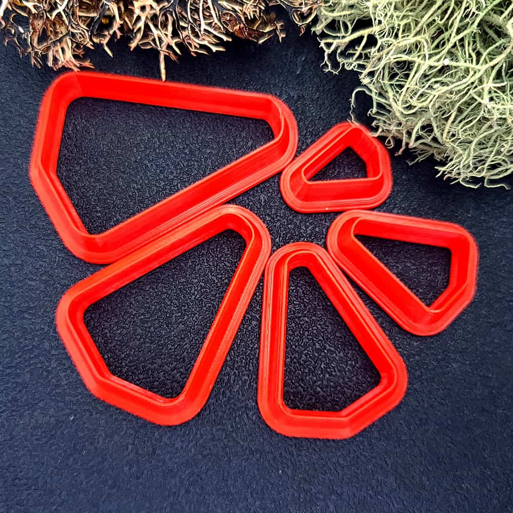 Rounded triangle polymer clay cutter with soft corners and apex at top